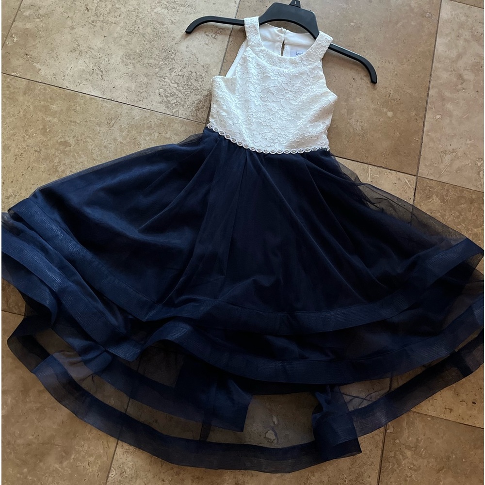 Sleeveless white bodice with rhinestones at front. Back zipper. Ties at back.